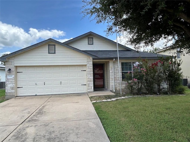 2101 Whistling Way, Taylor, TX 76574 - ranch-style house featuring concrete driveway, a front yard, a garage, and stone siding