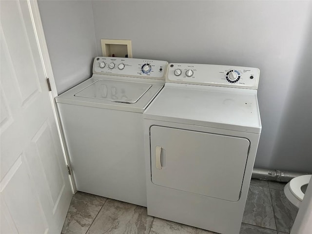 3819 Ranch Road 620th Rd N, Austin, TX 78734 - laundry area with light marble finish floors and independent washer and dryer