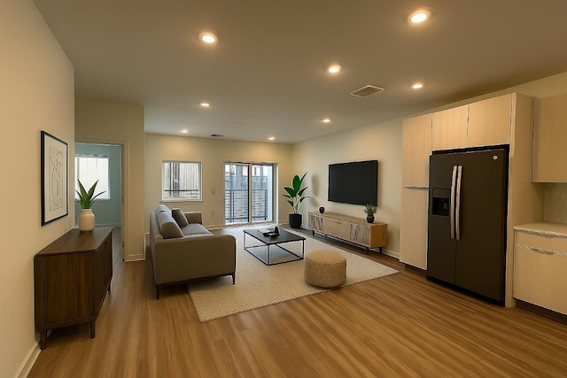4802 S Congress Ave Unit 217, Austin, TX 78745 - living room featuring light wood-type flooring and recessed lighting