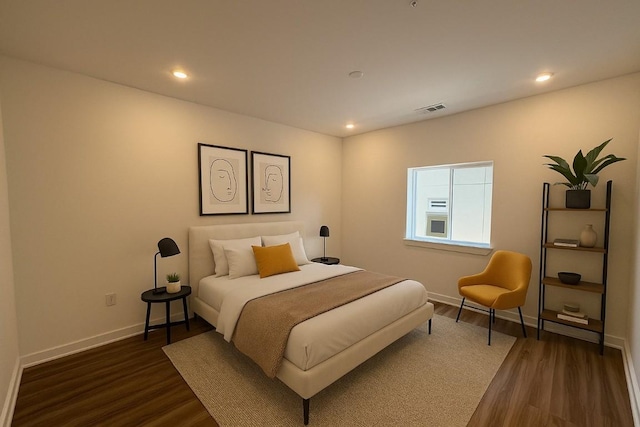 4802 S Congress Ave Unit 217, Austin, TX 78745 - bedroom featuring dark wood-style flooring and recessed lighting