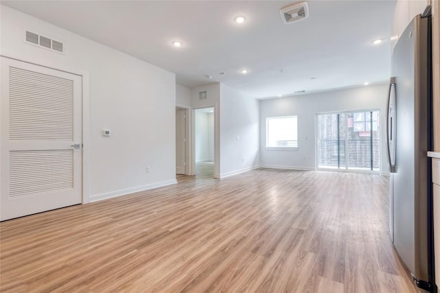 4802 S Congress Ave Unit 217, Austin, TX 78745 - spare room featuring light wood-style flooring and recessed lighting