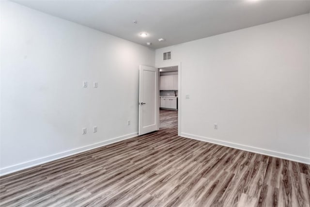 4802 S Congress Ave Unit 217, Austin, TX 78745 - empty room featuring wood finished floors and baseboards