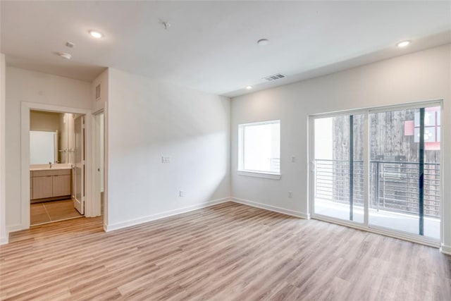 4802 S Congress Ave Unit 217, Austin, TX 78745 - unfurnished room featuring light wood-style flooring and recessed lighting