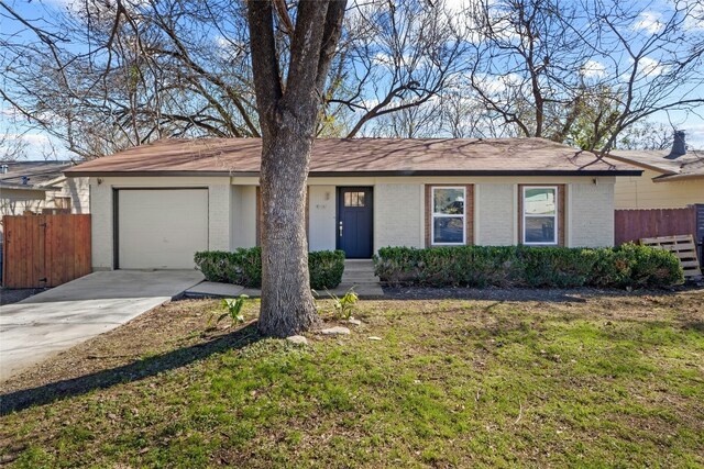 9417 N Creek Dr, Austin, TX 78753 - single story home featuring concrete driveway, brick siding, and an attached garage