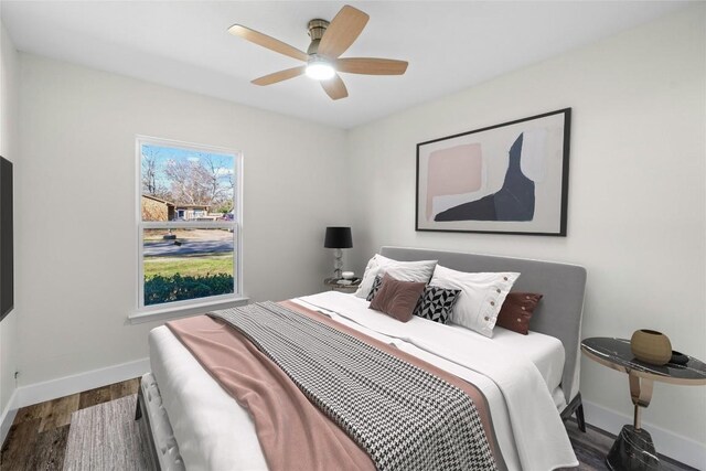 9417 N Creek Dr, Austin, TX 78753 - bedroom with wood finished floors and a ceiling fan