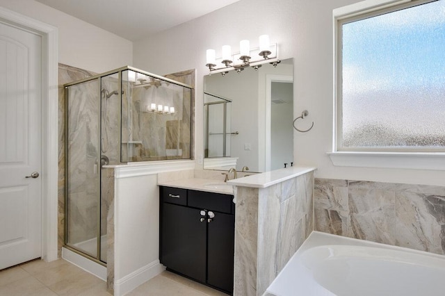 2521 Blended Tree Ranch Dr, Leander, TX 78641 - bathroom with vanity, a stall shower, a garden tub, and tile patterned flooring