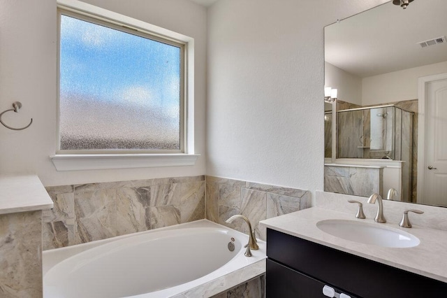 2521 Blended Tree Ranch Dr, Leander, TX 78641 - full bathroom featuring a bath, vanity, and a shower stall