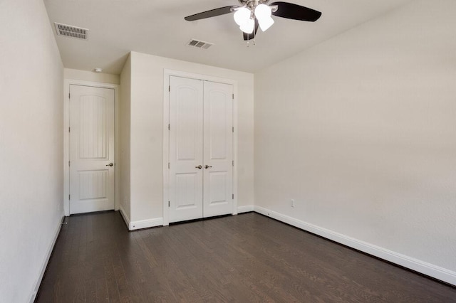 2521 Blended Tree Ranch Dr, Leander, TX 78641 - unfurnished bedroom featuring dark wood-type flooring, a closet, and a ceiling fan