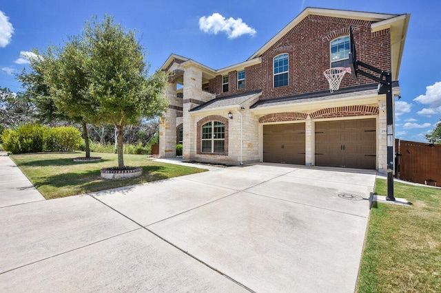2521 Blended Tree Ranch Dr, Leander, TX 78641 - view of front of house with a garage, driveway, stone siding, and brick siding