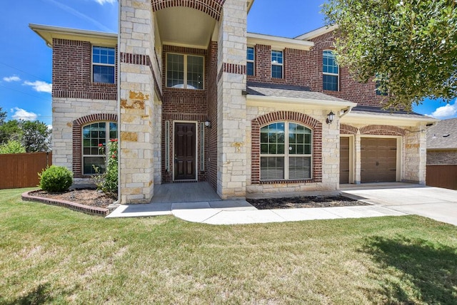 2521 Blended Tree Ranch Dr, Leander, TX 78641 - view of front facade featuring stone siding, concrete driveway, an attached garage, and a shingled roof