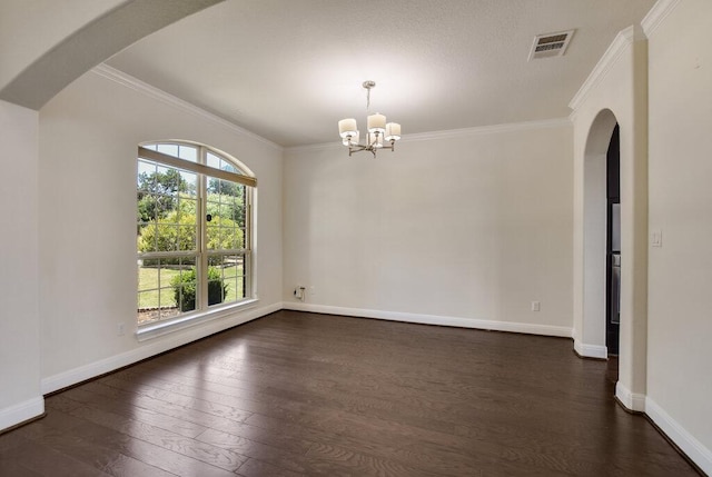 2521 Blended Tree Ranch Dr, Leander, TX 78641 - empty room featuring dark wood-style floors, a chandelier, ornamental molding, and arched walkways