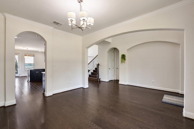 2521 Blended Tree Ranch Dr, Leander, TX 78641 - unfurnished room with dark wood-type flooring, a chandelier, ornamental molding, and stairs