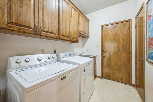 7 Hillway Dr, Round Rock, TX 78664 - laundry area with independent washer and dryer, cabinet space, light flooring, and a textured ceiling