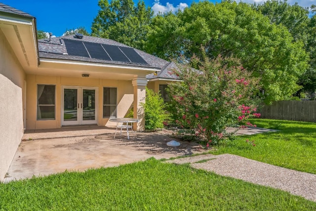 7 Hillway Dr, Round Rock, TX 78664 - back of house featuring french doors, stucco siding, a patio area, a shingled roof, and solar panels