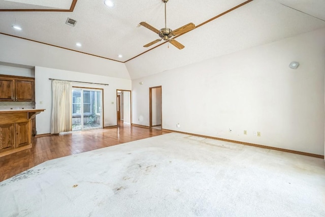 7 Hillway Dr, Round Rock, TX 78664 - unfurnished living room with carpet floors, recessed lighting, a ceiling fan, wood finished floors, and high vaulted ceiling