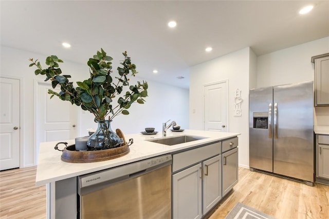 2928 Tantara Dr, Katy, TX 77493 - kitchen with stainless steel appliances, gray cabinets, an island with sink, and recessed lighting