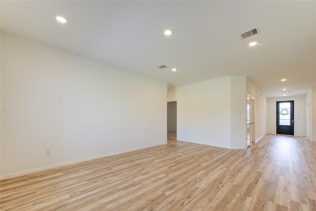 2928 Tantara Dr, Katy, TX 77493 - empty room with light wood finished floors and recessed lighting