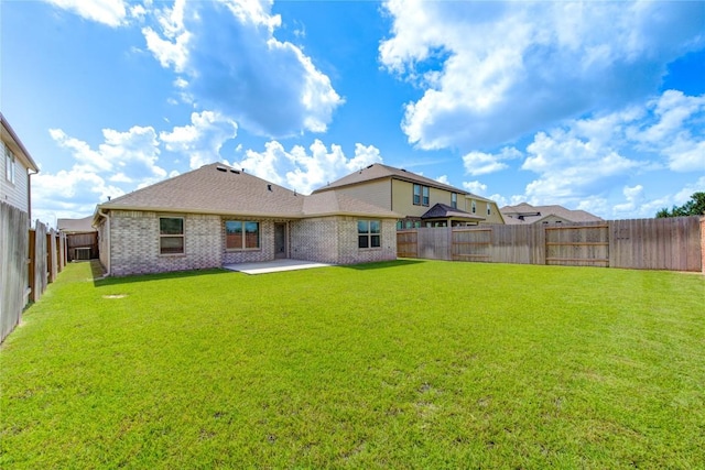 2928 Tantara Dr, Katy, TX 77493 - rear view of house featuring a patio area, a fenced backyard, and brick siding