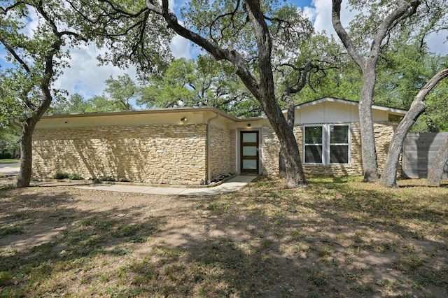 11508 Bell Ave, Austin, TX 78759 - mid-century home featuring stone siding