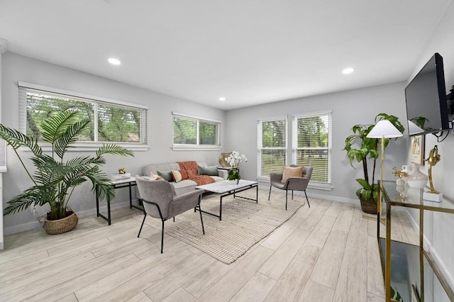 11508 Bell Ave, Austin, TX 78759 - living room featuring light wood-style floors, plenty of natural light, and recessed lighting