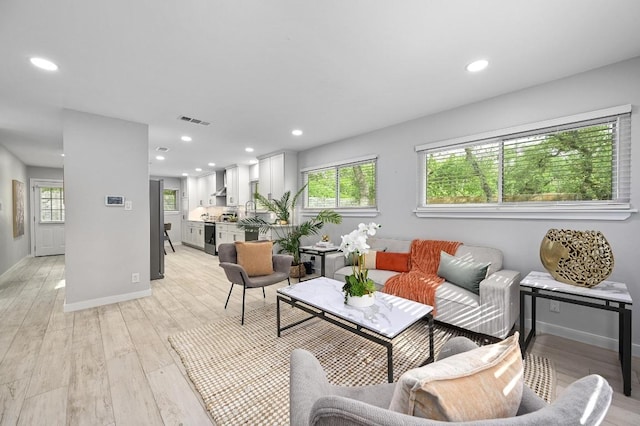 11508 Bell Ave, Austin, TX 78759 - living area with light wood finished floors and recessed lighting