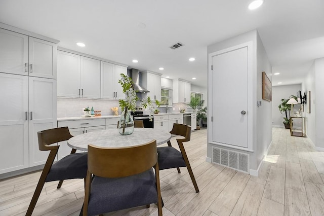 11508 Bell Ave, Austin, TX 78759 - dining space featuring light wood finished floors and recessed lighting