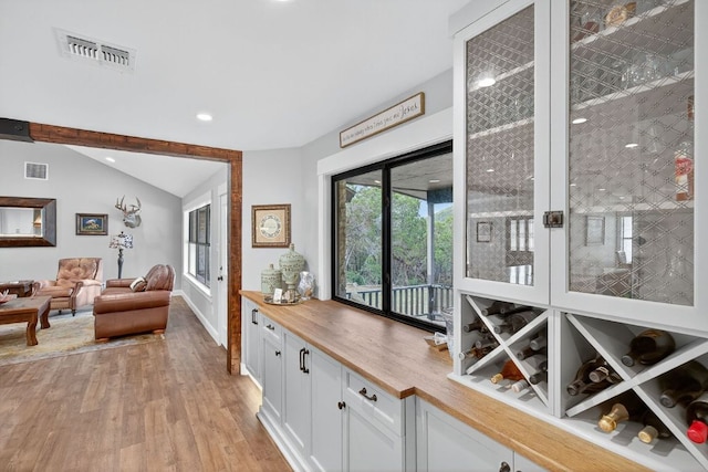 23644 Nameless Rd, Leander, TX 78641 - hall with light wood-style floors, vaulted ceiling, and recessed lighting