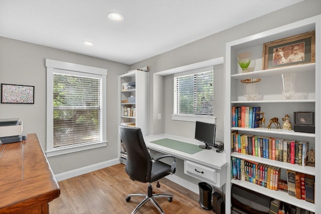 23644 Nameless Rd, Leander, TX 78641 - home office with recessed lighting and light wood-style flooring
