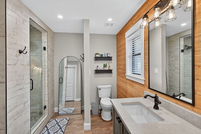 23644 Nameless Rd, Leander, TX 78641 - bathroom with vanity, a stall shower, wood finished floors, and recessed lighting