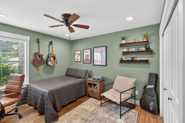 23644 Nameless Rd, Leander, TX 78641 - bedroom featuring wood finished floors, recessed lighting, and a ceiling fan