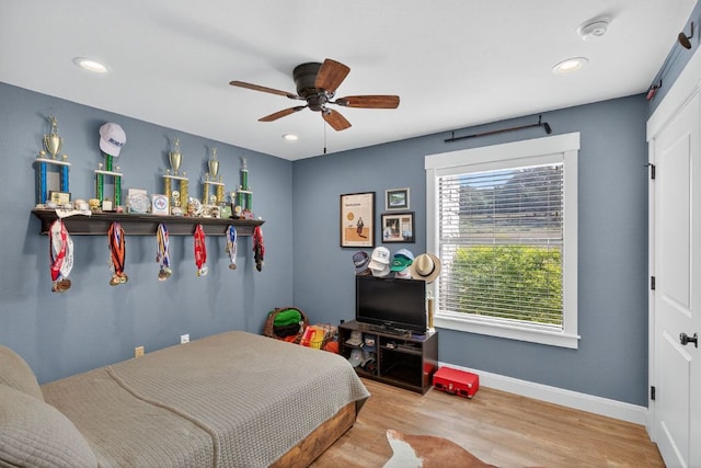 23644 Nameless Rd, Leander, TX 78641 - bedroom featuring wood finished floors, recessed lighting, and a ceiling fan