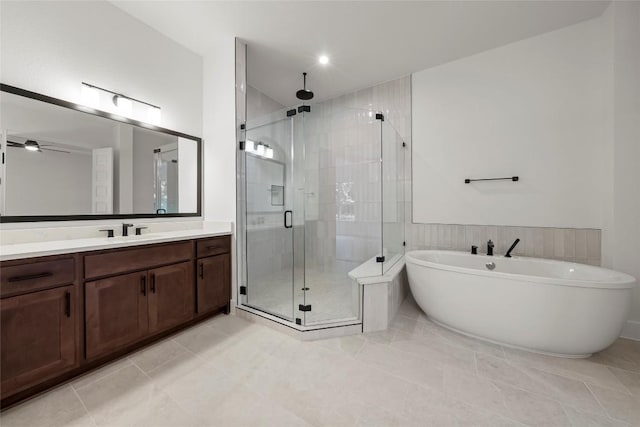 3937 Veneto Cir, Leander, TX 78641 - bathroom featuring a stall shower, vanity, a soaking tub, and ceiling fan