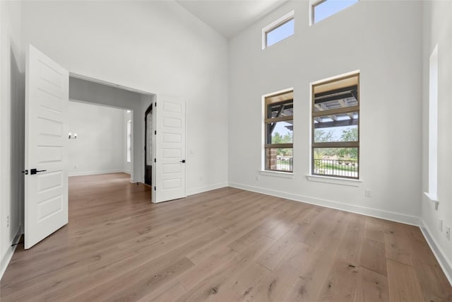 3937 Veneto Cir, Leander, TX 78641 - unfurnished room featuring a high ceiling and light wood-style floors