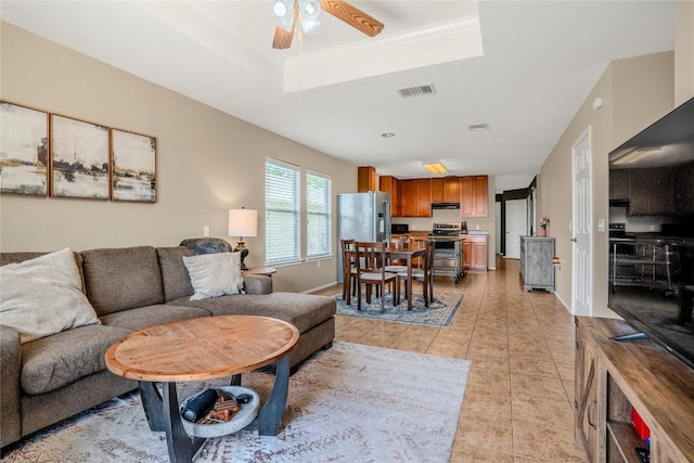 8925 China Rose Dr, Austin, TX 78724 - living area featuring a tray ceiling, ceiling fan, and light tile patterned floors