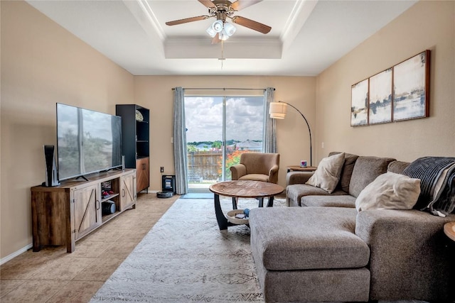 8925 China Rose Dr, Austin, TX 78724 - living room with a raised ceiling, a ceiling fan, crown molding, and light tile patterned floors