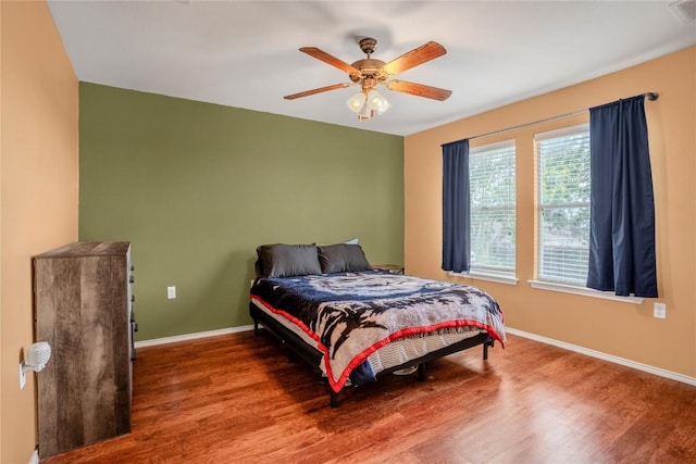 8925 China Rose Dr, Austin, TX 78724 - bedroom with wood finished floors and ceiling fan