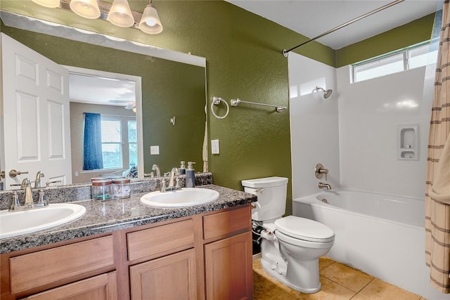 8925 China Rose Dr, Austin, TX 78724 - full bathroom with double vanity, tile patterned flooring, shower / bathtub combination, and a textured wall