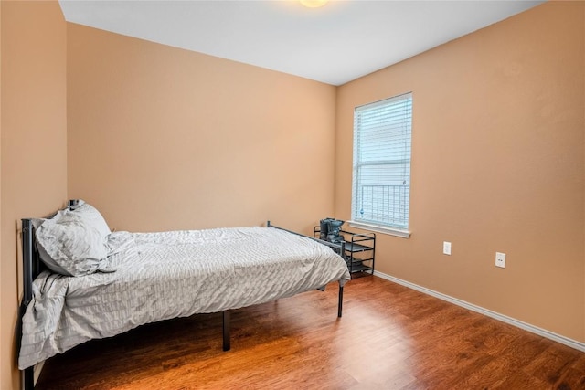 8925 China Rose Dr, Austin, TX 78724 - bedroom with wood finished floors and baseboards