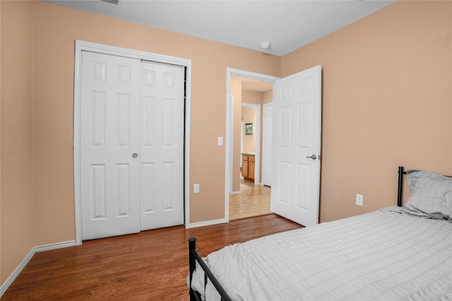 8925 China Rose Dr, Austin, TX 78724 - bedroom with wood finished floors and a closet