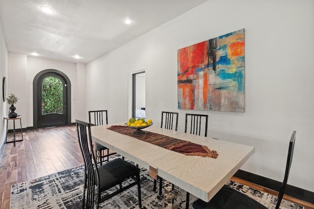1310 Minnie Dr, Austin, TX 78732 - dining space featuring hardwood / wood-style floors, recessed lighting, and arched walkways