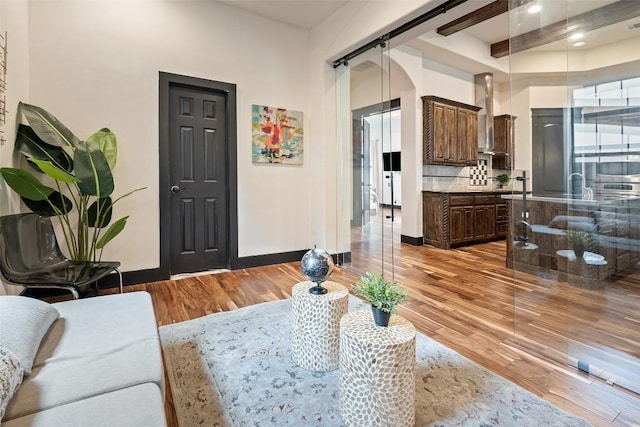 1310 Minnie Dr, Austin, TX 78732 - living room with light wood-style flooring, beamed ceiling, and recessed lighting