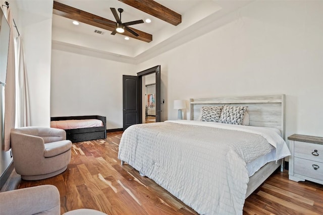 1310 Minnie Dr, Austin, TX 78732 - bedroom with wood finished floors, beamed ceiling, a ceiling fan, and recessed lighting