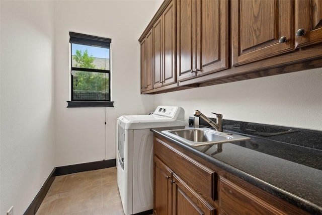 1310 Minnie Dr, Austin, TX 78732 - laundry room with separate washer and dryer, cabinet space, and light tile patterned floors