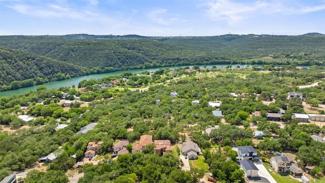 1310 Minnie Dr, Austin, TX 78732 - aerial view of residential area with a nearby body of water and a heavily wooded area