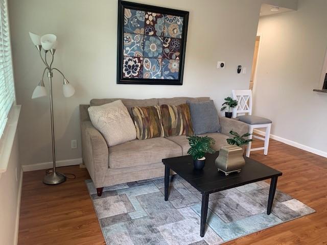 6004 Blythewood Dr, Austin, TX 78745 - living room featuring wood finished floors and baseboards