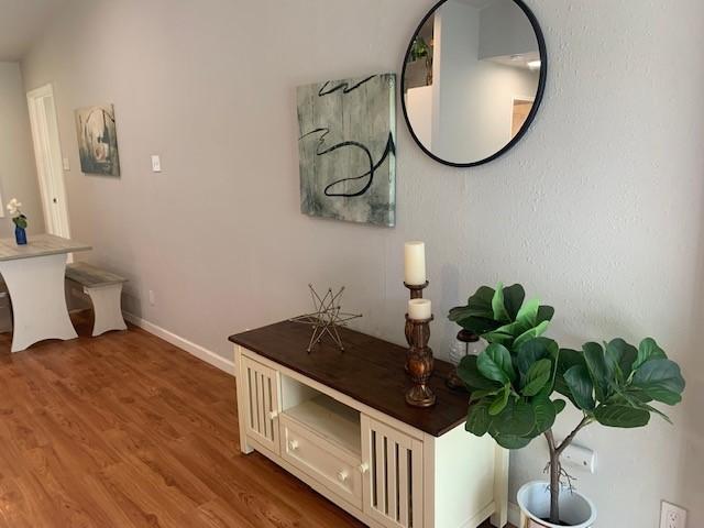 6004 Blythewood Dr, Austin, TX 78745 - hall featuring wood finished floors and baseboards