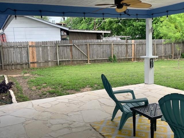 6004 Blythewood Dr, Austin, TX 78745 - fenced backyard featuring a ceiling fan and a patio area