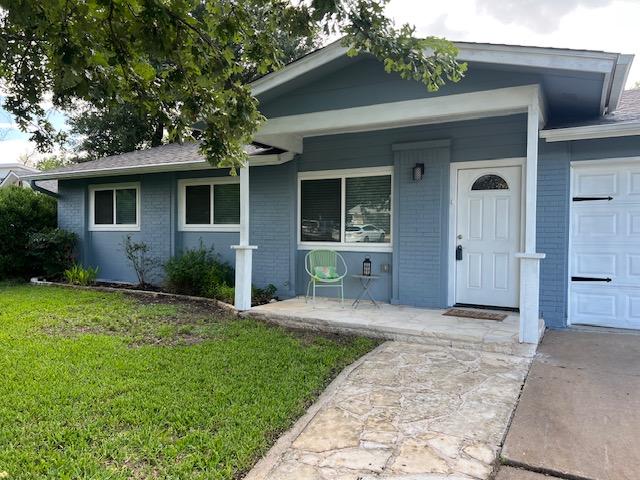 6004 Blythewood Dr, Austin, TX 78745 - view of front of home featuring a front yard, a porch, and brick siding