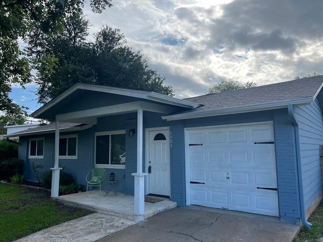 6004 Blythewood Dr, Austin, TX 78745 - view of front of property featuring concrete driveway, a garage, and a porch
