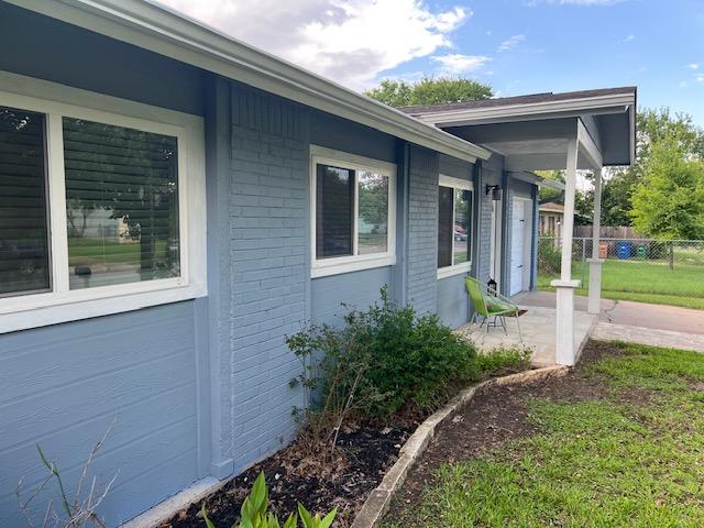 6004 Blythewood Dr, Austin, TX 78745 - view of property exterior featuring brick siding and a patio area